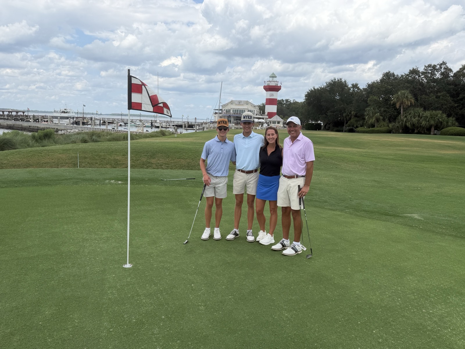 Austie Strong family together on a golf course